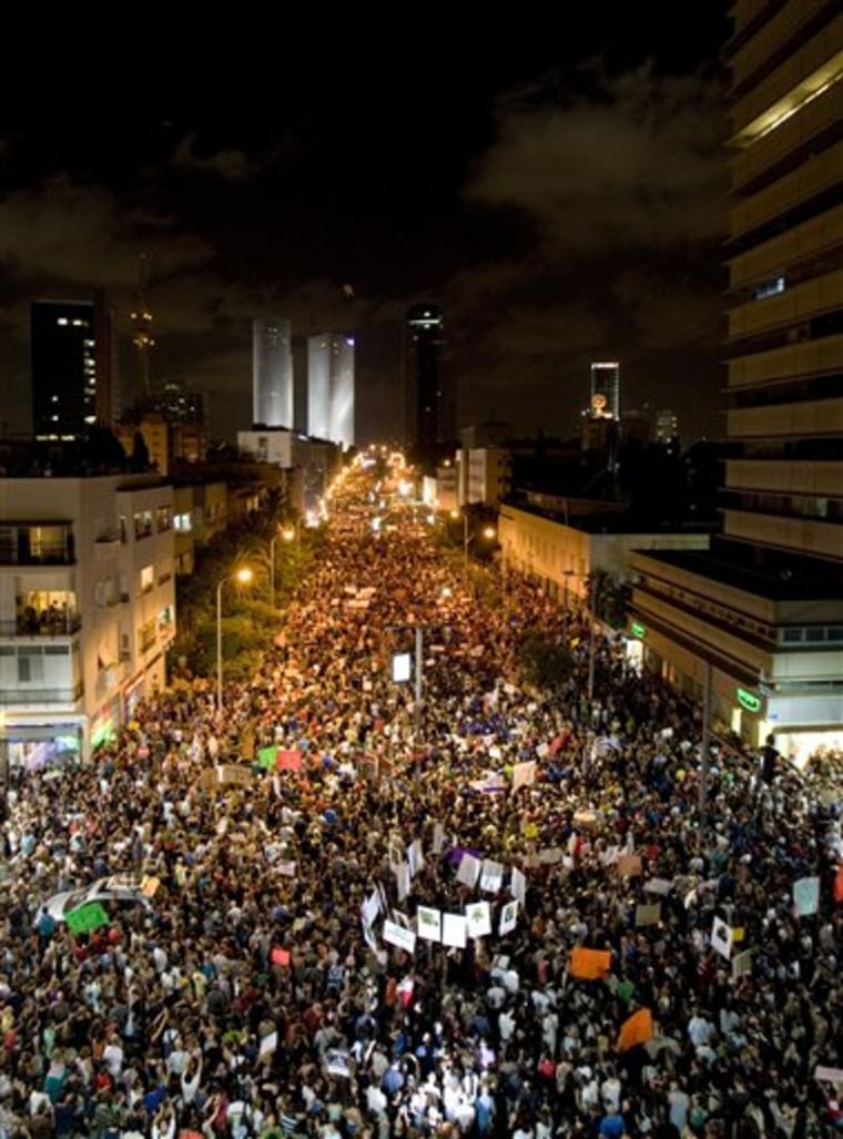 Thousands of Israelis march Saturday in Tel Aviv, during a protest against the rising cost of living.